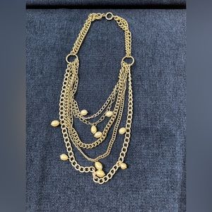 Multi tiered necklace in silver tone with freshwater pearl drops